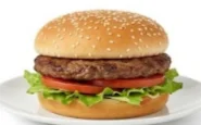 Angus-Quarter-Pound-Hamburger Classic Angus beef hamburger with lettuce and tomato on a sesame bun.