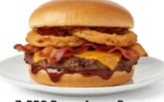 BBQ-Bacon-Angus-Burger-with-Onion-Rings Angus burger with crispy bacon, onion rings, and tangy BBQ sauce.