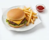 Kids-Cheeseburger-and-Fries-Plate Small cheeseburger for kids served with a side of crispy french fries and ketchup.