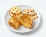Kids-Grilled-Cheese-Sandwich-Snack-Plate Toasted kids' grilled cheese sandwich with apple slices and animal crackers.