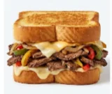 Texas-Cheesesteak-Melt Texas toast sandwich with thinly sliced steak, melted cheese, and peppers.